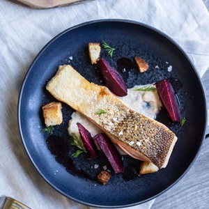 Wild crispy skin salmon with white bean and coriander puree