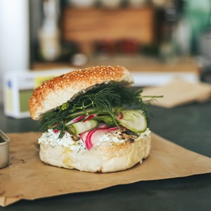 Fresh sardine bagel with pickled veg and herbed cheese
