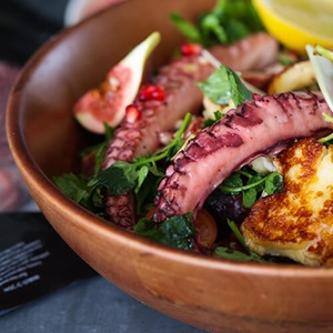 Wild halloumi and pomegranate octopus salad