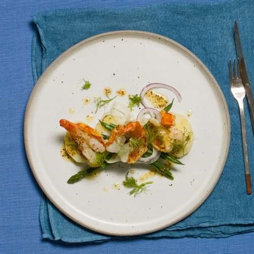 Seared king prawns with fennel, asparagus, green beans and potatoes