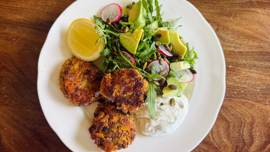 Sardine fishcakes by Dr Joanna McMillan Plump, slightly crisp Sardine Fishcakes with a fresh green salad with rocket, avocado, radish, next to a healthy dollop of herby yoghurt and a drizzle of honey.