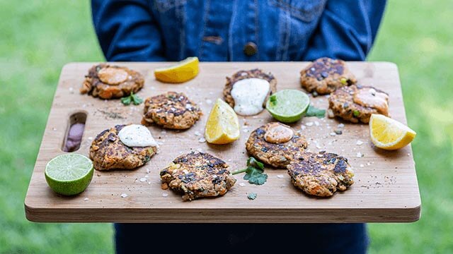 Tuna Fishcakes being held on a board