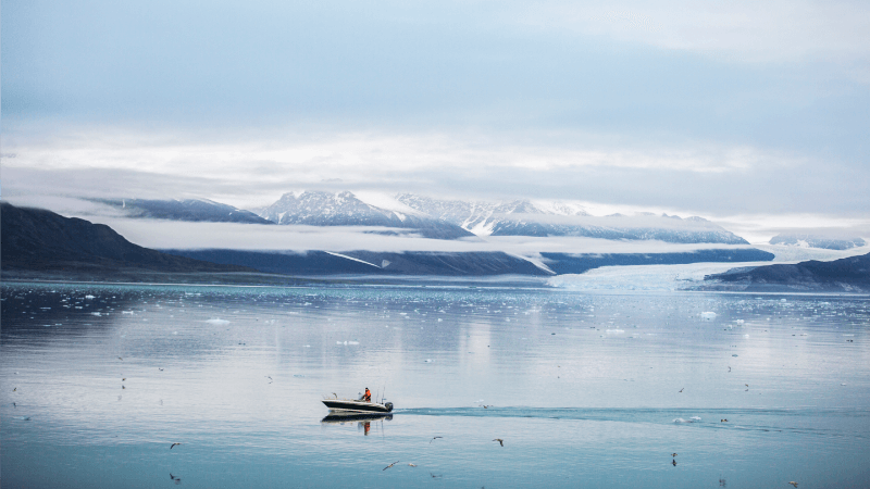 boat on ocean with ice