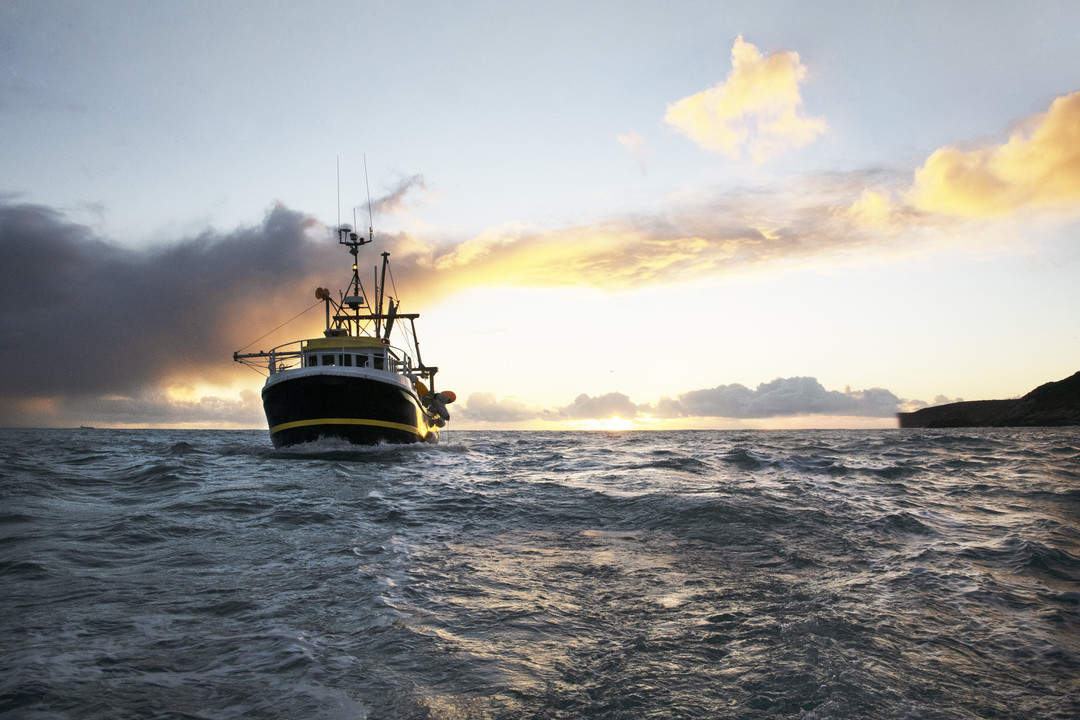 Fisher boat in sunset