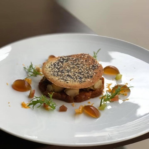 Tarte fine aux bulots, oranges et tomates