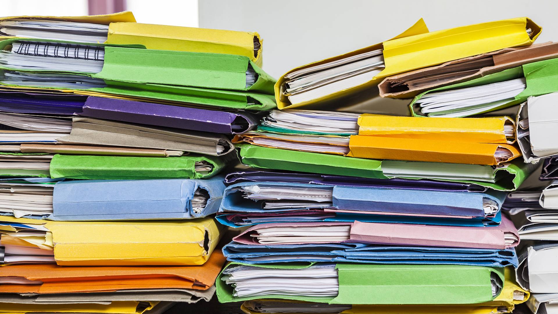 Piles of colourful document folders