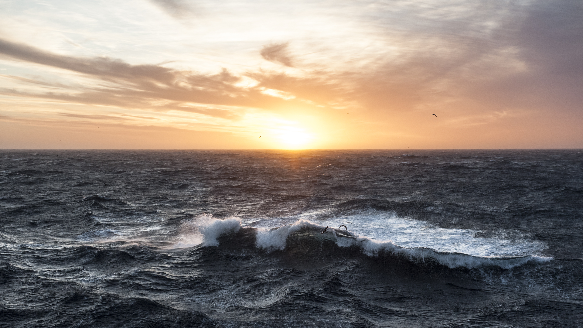 Sunset in the Southern Atlantic with a crashing wave
