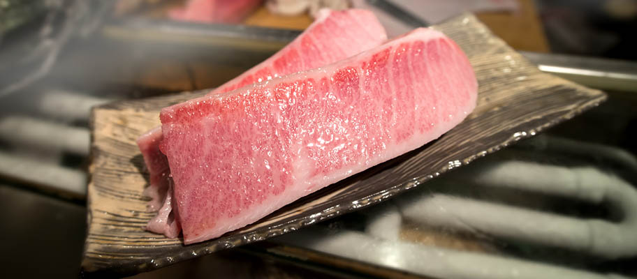 Raw tuna slices on dish