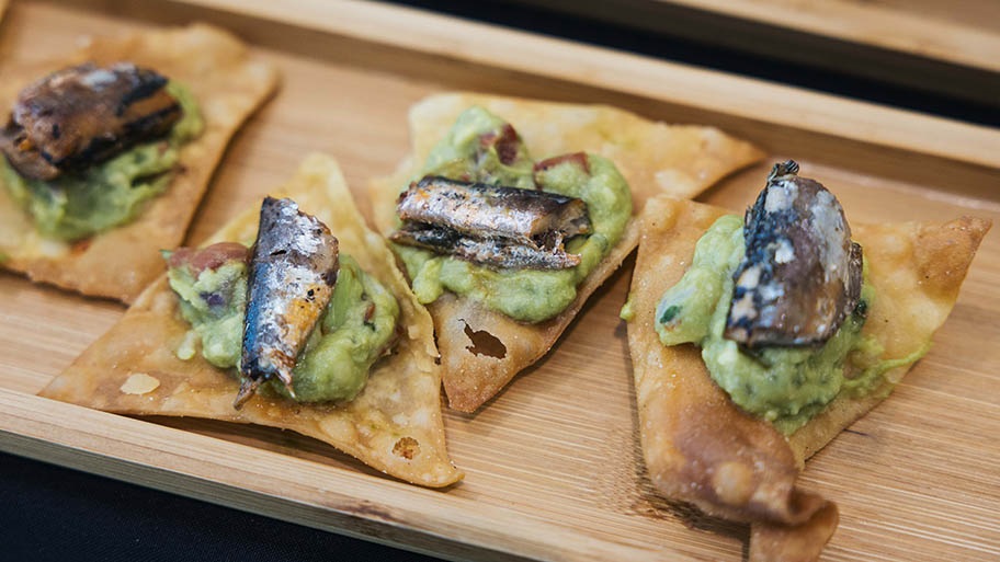 Iberian sardine with guacamole on fried tortillas