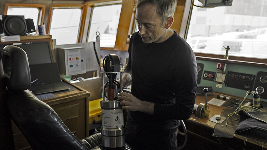 Thomas Götz in cabin of ship with acoustic deterrent device