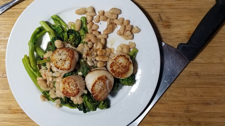 Seared Scallops with cannellini beans and brocolini.