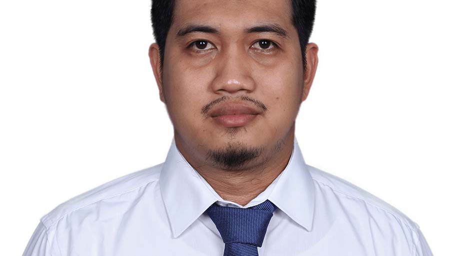 Head shot of man in shirt and tie on plain white background