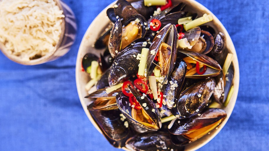 Spicy mussels dish in bowl, aerial shot