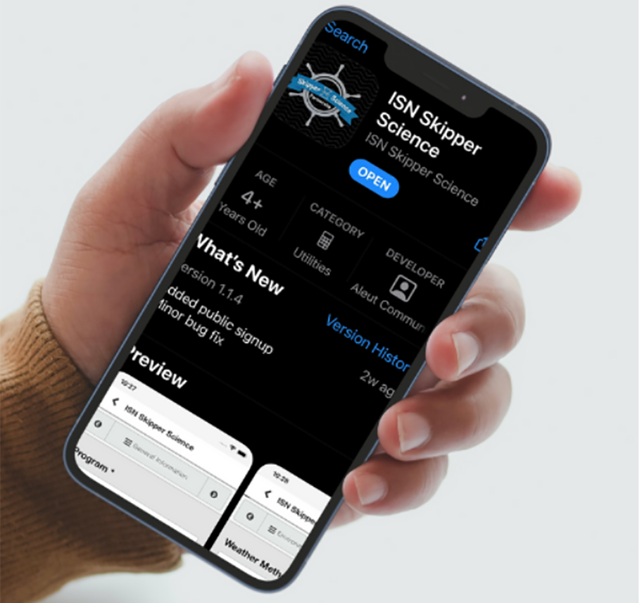 Close-up of hand holding smartphone with  Skipper Science app on screen