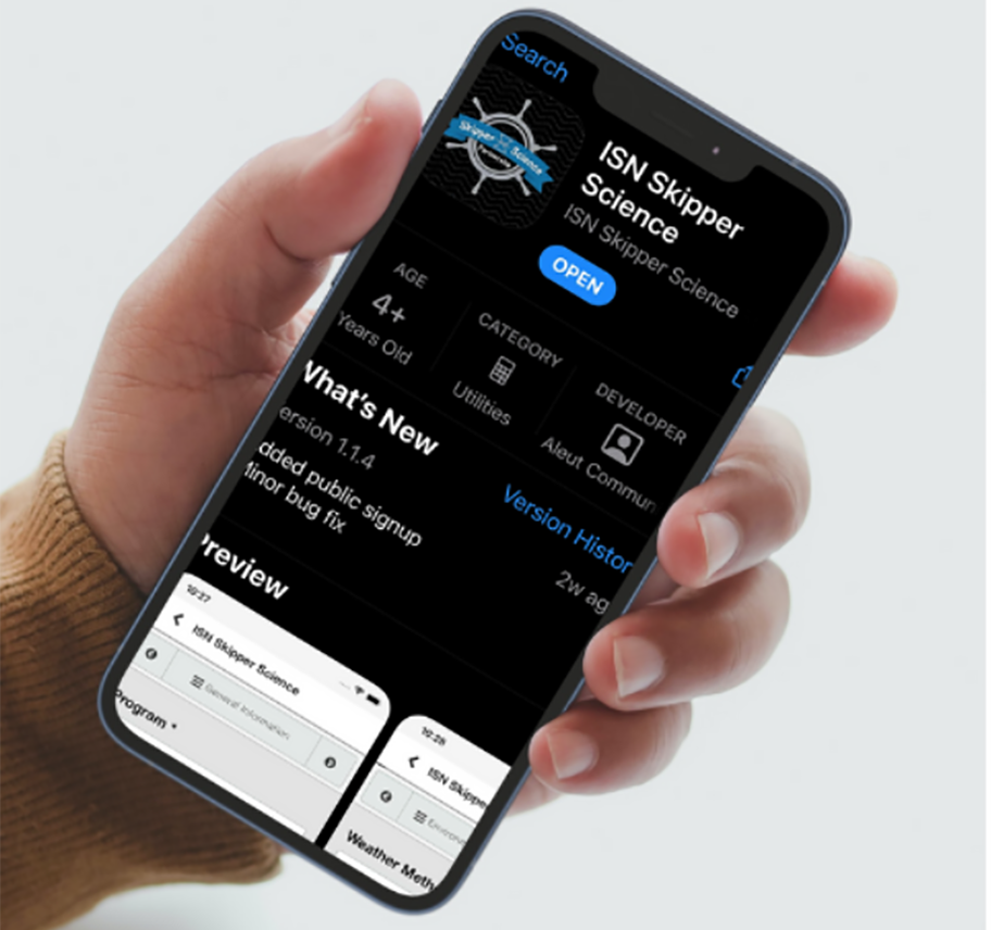 Close-up of hand holding smartphone with Skipper Science app on screen