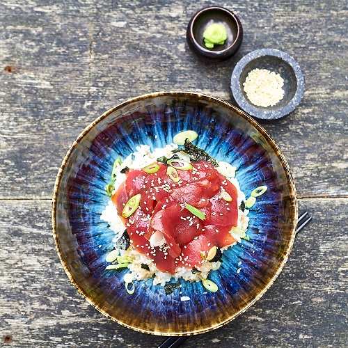 Serving suggestion for marinated rice bowl - tuna in centre of bowl surrounded by rice