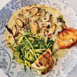 Creamy mussels with ‘courgetti’ pasta