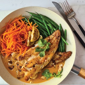 Grilled hake with Thai red curry sauce
