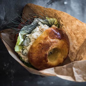 Hake on a bagel with cropped lettuce