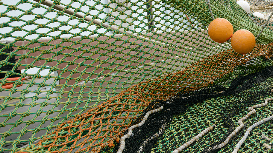 Green fishing nets with orange buoys