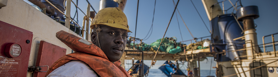 South African hake fisherman on deck looking into distance