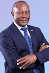 Portrait photo of man in suit: Eddy Njoroge