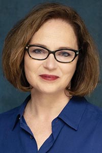 Headshot of woman with glasses: Mikel Durham