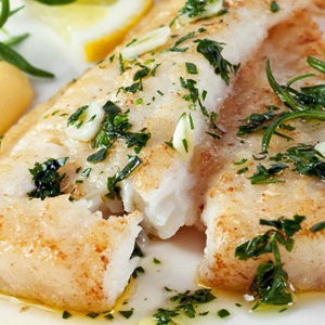 Pan fried hake with crisp sweet garlic