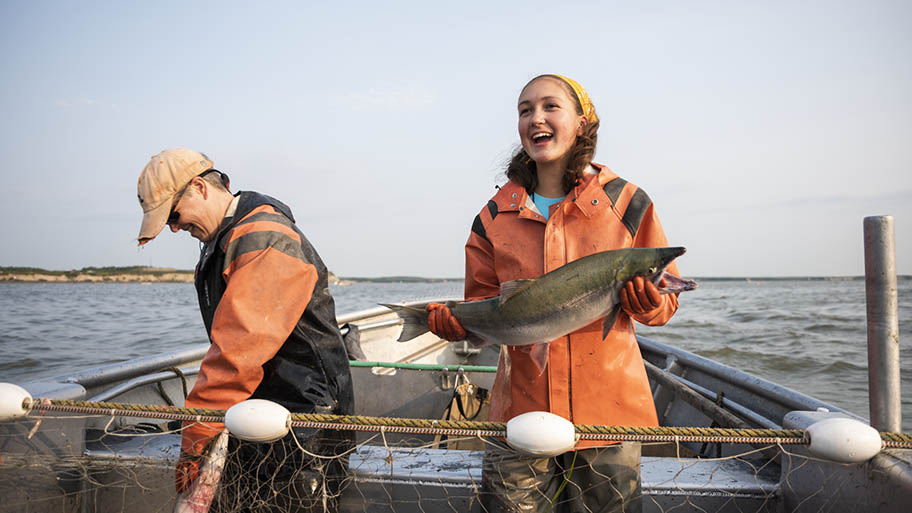 emily-taylor-smiling-holding-fish-wild-alaska-salmon-fishery-visit-bristol-bay Sustainable Salmon Fishing of Bristol Bay, Alaska
