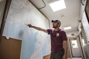 Fishery manager pointing at map