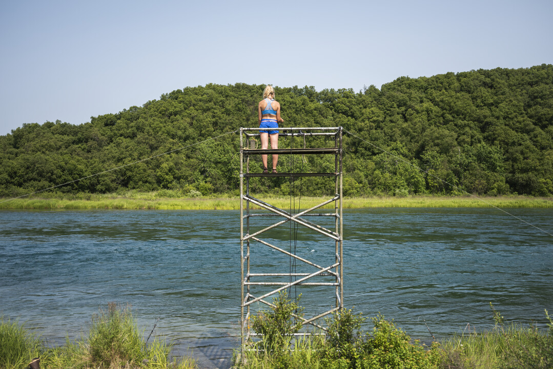 Salmon fishery manager Fishery manager on top of a tall tower overlooking a river
