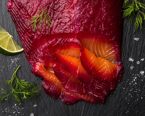 cured salmon with deep purple-pink hue from curing ingredient