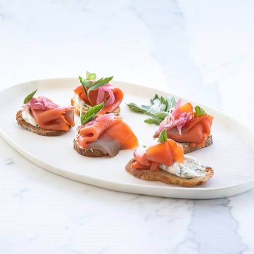 Smoked wild salmon crostinis, herbed cream cheese and pickled shallots