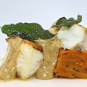Wild halibut with squash pavé, sage and brown butter hollandaise