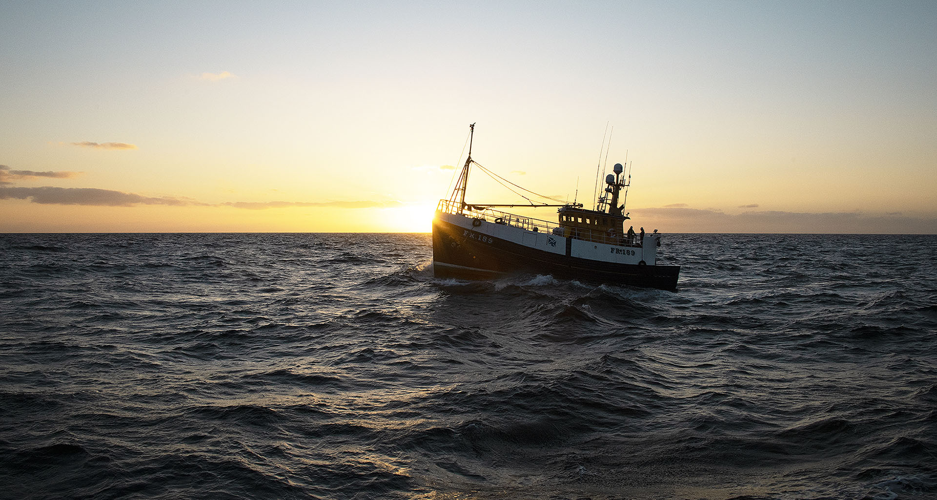 Fishing boat out on sea Scottish haddock fishing boat