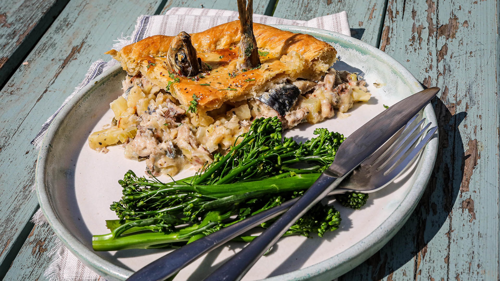 Stargazy pie slice with broccoli