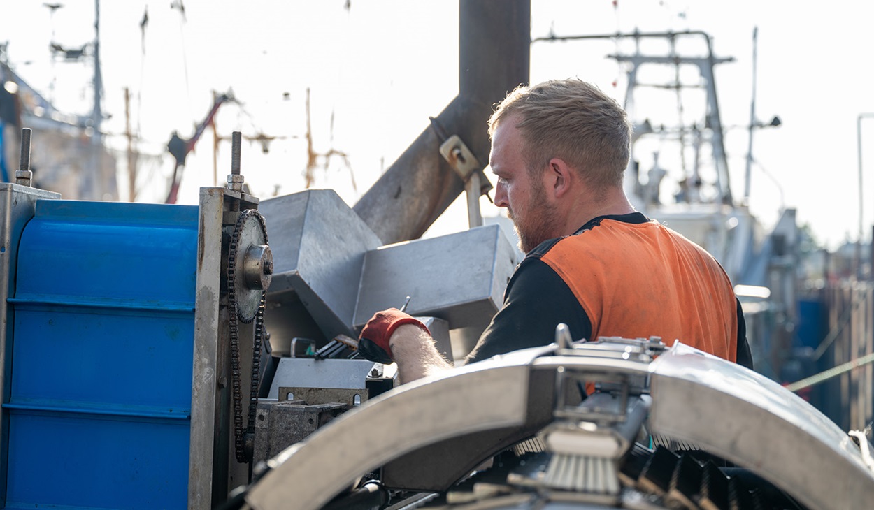 Engineer Alex Smith fixes shrimp fishing vessel gear