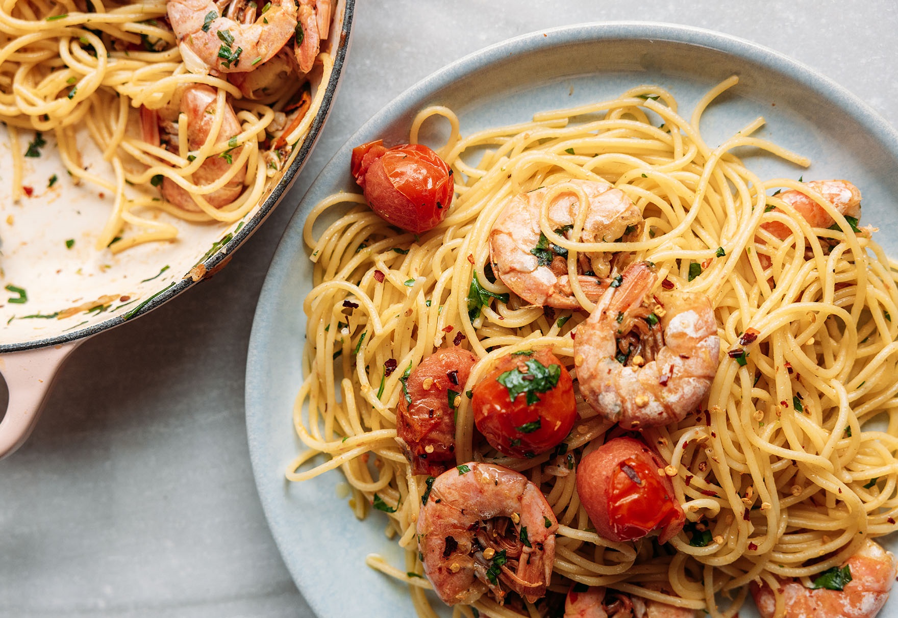 Prawn spaghetti with cherry tomatoes on the table