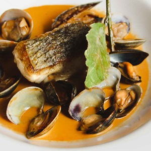 Hake with shellfish sauce, mussels and cockles