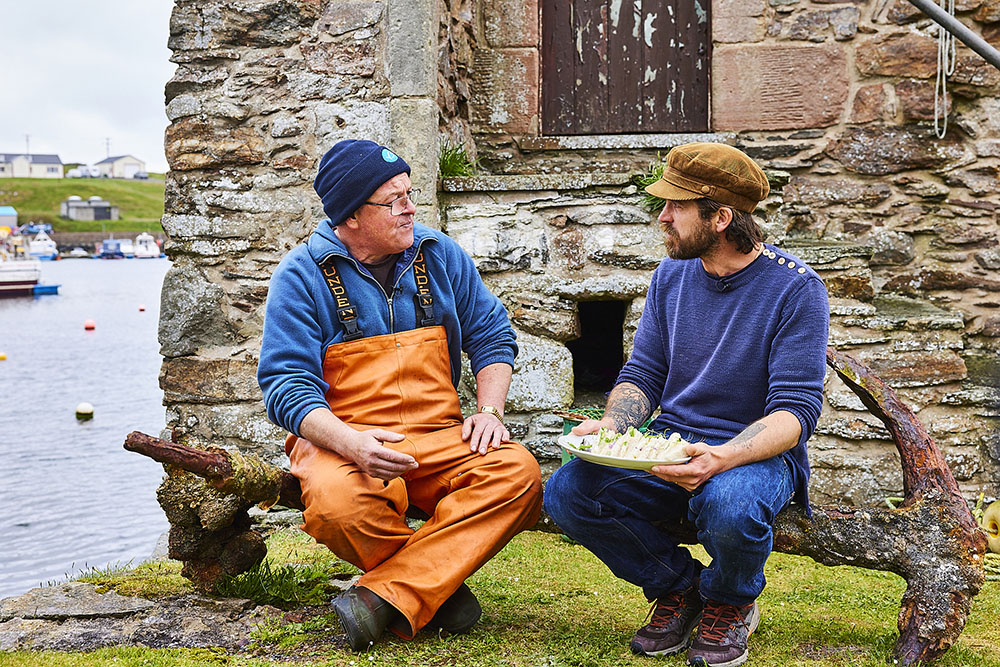 James Strawbridge and Fisher George Andrew sat on old anchor