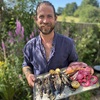 Chef James Strawbridge with plate of grilled fish