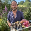 Chef James Strawbridge with plate of grilled fish