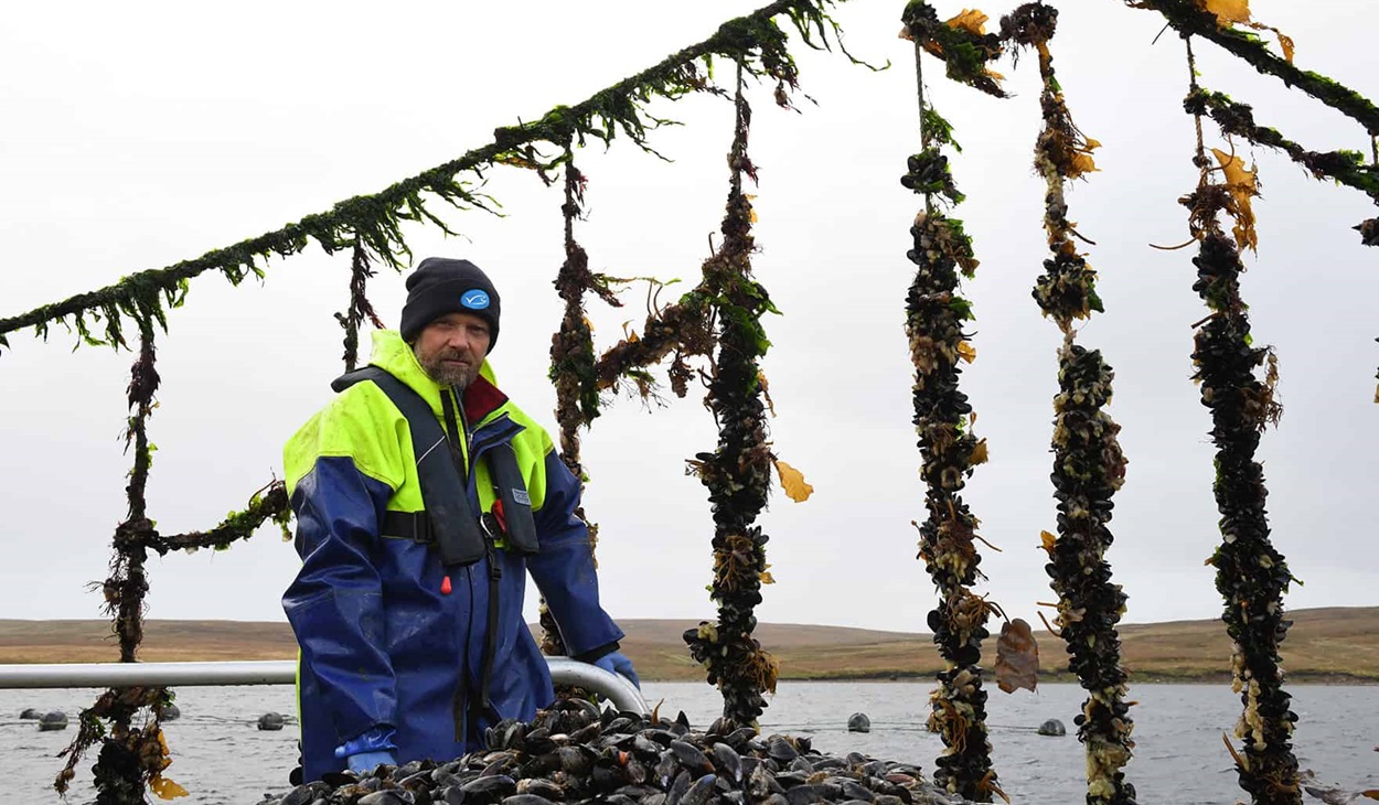 Scottish mussel fisherman next to ropes
