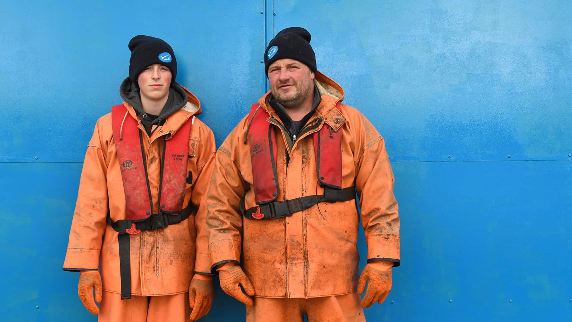 Father and son Craig and Kenny Pottinger in orange fishing clothes